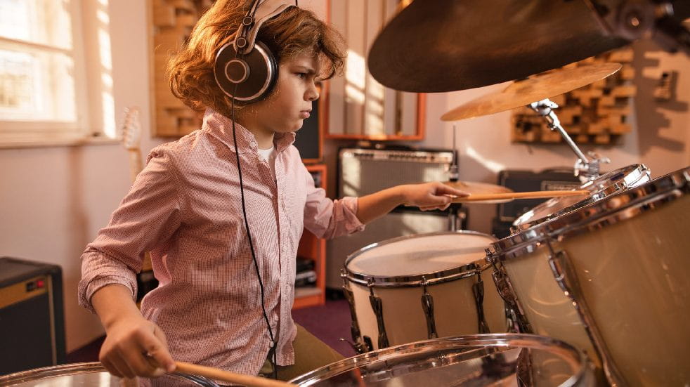 boy in studio on drum kit